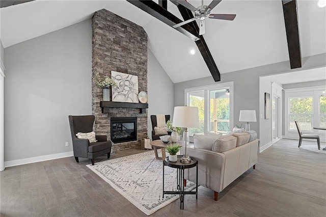 19433 W 114th Ter, Olathe, KS 66061 - living area with baseboards, high vaulted ceiling, a ceiling fan, wood finished floors, and beam ceiling