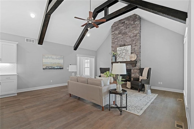 19433 W 114th Ter, Olathe, KS 66061 - living area featuring ceiling fan, baseboards, beamed ceiling, dark wood-style flooring, and a fireplace