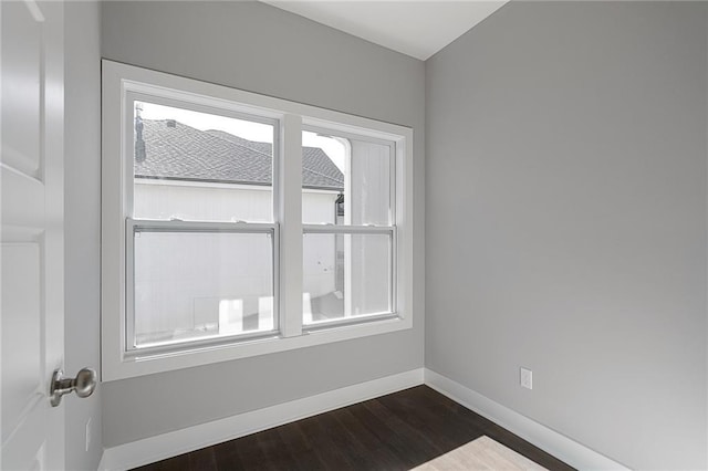 19433 W 114th Ter, Olathe, KS 66061 - unfurnished room featuring dark wood-type flooring and baseboards