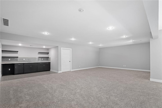 19433 W 114th Ter, Olathe, KS 66061 - unfurnished living room with carpet flooring, recessed lighting, baseboards, and a sink