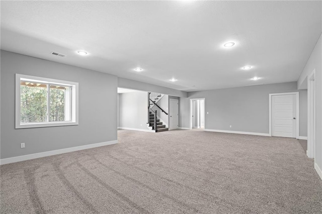 19433 W 114th Ter, Olathe, KS 66061 - spare room featuring stairs, carpet floors, baseboards, and recessed lighting