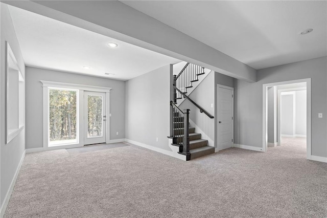 19433 W 114th Ter, Olathe, KS 66061 - unfurnished living room featuring carpet, stairs, baseboards, and recessed lighting