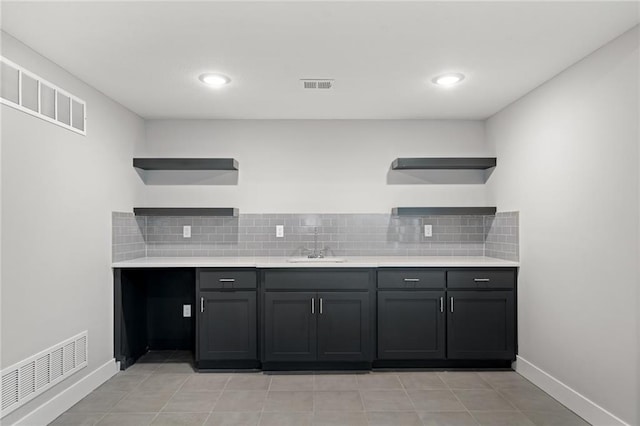 19433 W 114th Ter, Olathe, KS 66061 - kitchen with open shelves, a sink, backsplash, light countertops, and recessed lighting