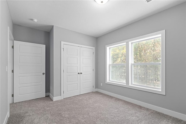 19433 W 114th Ter, Olathe, KS 66061 - unfurnished bedroom with carpet flooring, baseboards, and a closet