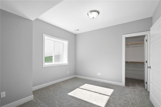 19433 W 114th Ter, Olathe, KS 66061 - unfurnished bedroom featuring carpet floors, a spacious closet, baseboards, and a closet