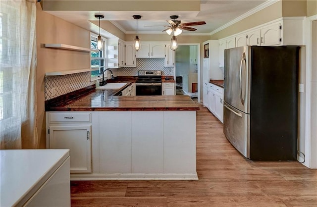 739 SW 700th Rd, Holden, MO 64040 - kitchen featuring appliances with stainless steel finishes, a sink, dark countertops, a peninsula, and open shelves