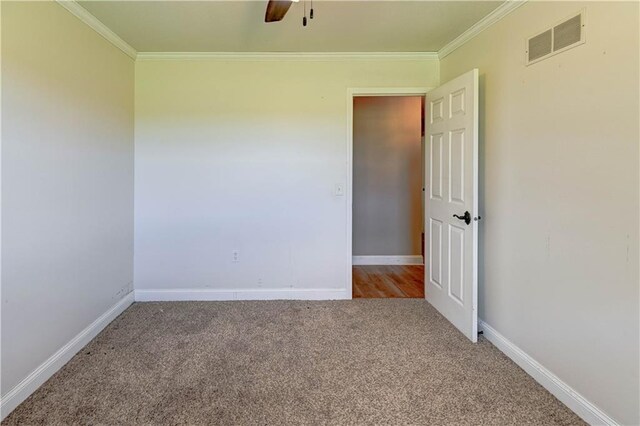 739 SW 700th Rd, Holden, MO 64040 - unfurnished room with ornamental molding, carpet floors, a ceiling fan, and baseboards
