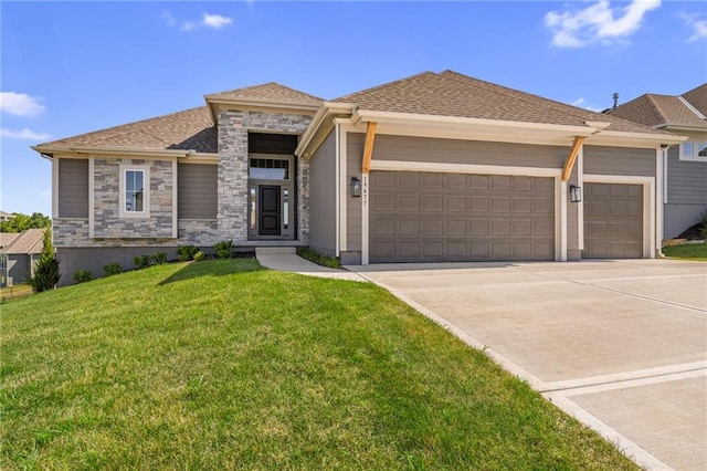 19477 W 114th Ter, Olathe, KS 66061 - view of front facade featuring an attached garage, concrete driveway, a front lawn, stone siding, and roof with shingles