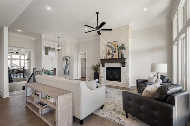 19477 W 114th Ter, Olathe, KS 66061 - living area featuring a ceiling fan, recessed lighting, crown molding, a fireplace, and wood finished floors