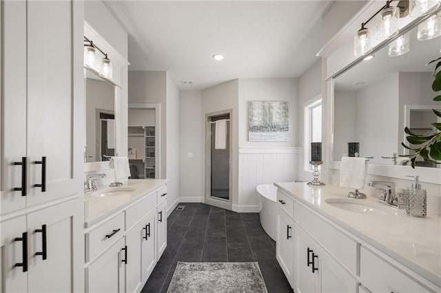 19477 W 114th Ter, Olathe, KS 66061 - full bath featuring vanity, a freestanding tub, tile patterned floors, a stall shower, and recessed lighting