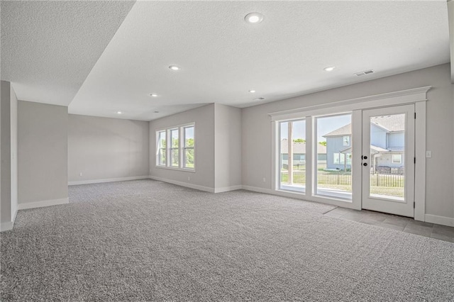 19477 W 114th Ter, Olathe, KS 66061 - spare room with a textured ceiling, carpet flooring, and recessed lighting