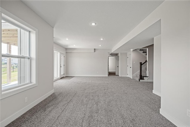 19477 W 114th Ter, Olathe, KS 66061 - unfurnished room featuring carpet flooring, recessed lighting, and stairway