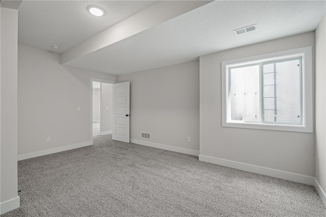 19477 W 114th Ter, Olathe, KS 66061 - carpeted spare room with a textured ceiling and baseboards
