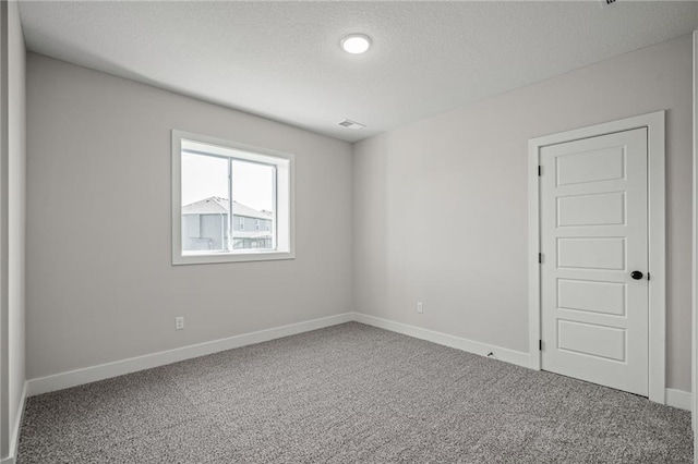 19477 W 114th Ter, Olathe, KS 66061 - carpeted spare room featuring a textured ceiling and baseboards