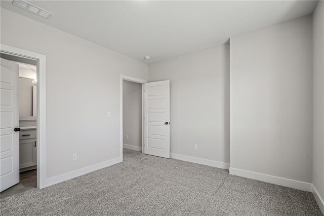 19477 W 114th Ter, Olathe, KS 66061 - unfurnished bedroom with carpet floors and connected bathroom