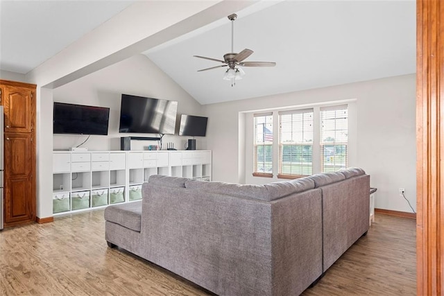 601 W 3rd Ter, Wellsville, KS 66092 - living area featuring wood finished floors, lofted ceiling, a ceiling fan, and baseboards