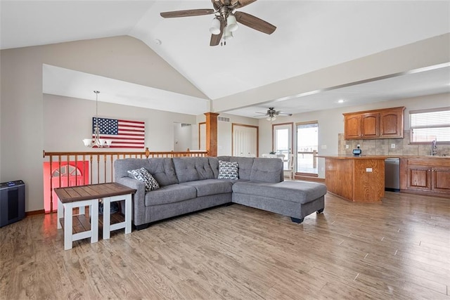 601 W 3rd Ter, Wellsville, KS 66092 - living area with a ceiling fan, light wood-style flooring, healthy amount of natural light, and lofted ceiling
