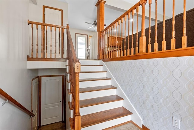 601 W 3rd Ter, Wellsville, KS 66092 - stairs with ceiling fan, wood finished floors, and baseboards