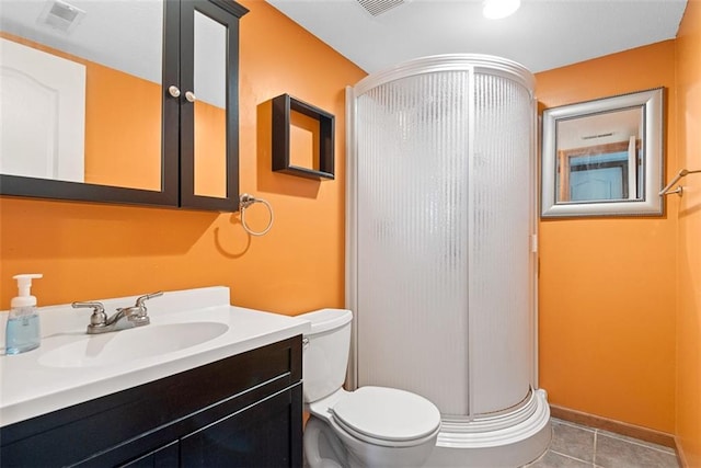 601 W 3rd Ter, Wellsville, KS 66092 - bathroom with a stall shower, toilet, vanity, and tile patterned floors
