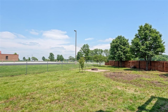 601 W 3rd Ter, Wellsville, KS 66092 - view of yard featuring a fire pit