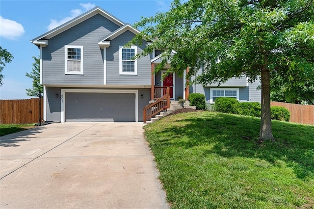 601 W 3rd Ter, Wellsville, KS 66092 - view of front of home featuring a garage and driveway