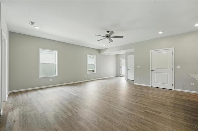 801 Highland Dr, Edwardsville, KS 66111 - empty room with a ceiling fan, wood finished floors, baseboards, and recessed lighting