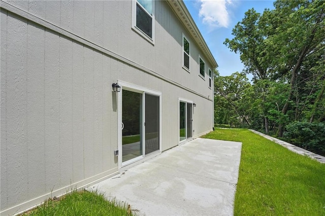 801 Highland Dr, Edwardsville, KS 66111 - rear view of house with a patio and a yard