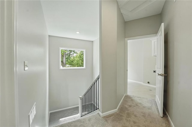 801 Highland Dr, Edwardsville, KS 66111 - corridor featuring light carpet, an upstairs landing, attic access, and baseboards