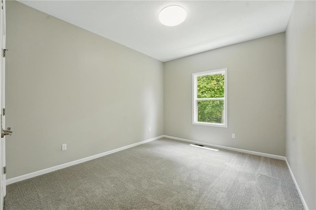 801 Highland Dr, Edwardsville, KS 66111 - carpeted spare room with baseboards