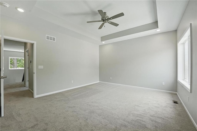 801 Highland Dr, Edwardsville, KS 66111 - carpeted spare room with baseboards, ceiling fan, recessed lighting, a raised ceiling, and a smoke detector