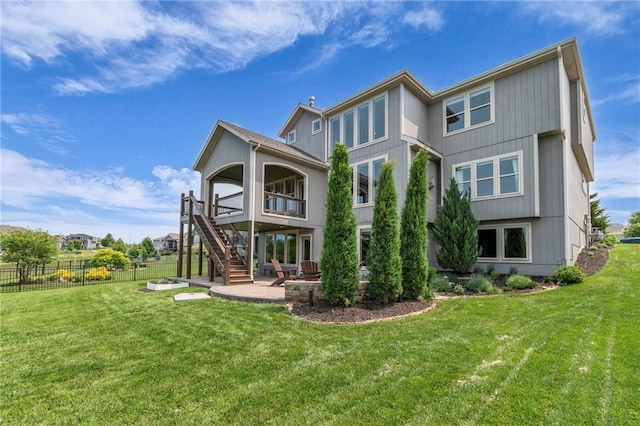 9812 Saddletop St, Lenexa, KS 66227 - rear view of house with stairway and a patio area