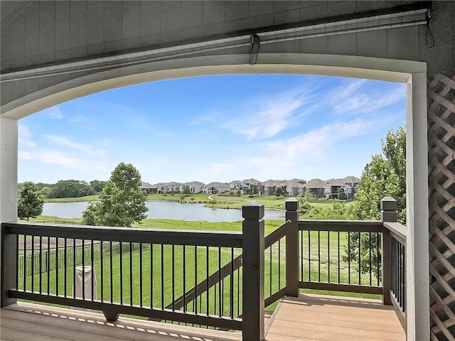 9812 Saddletop St, Lenexa, KS 66227 - wooden deck featuring a water view, a residential view, and a lawn
