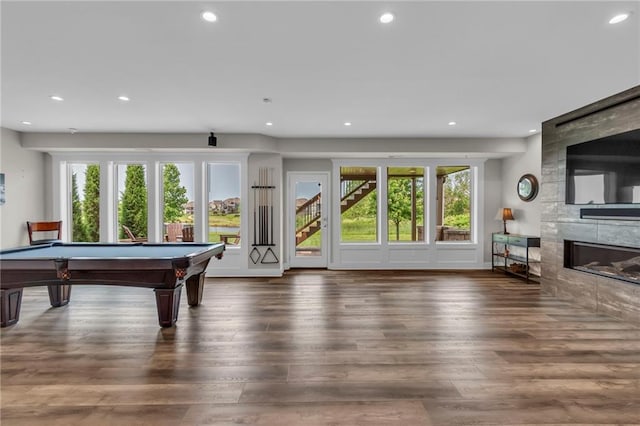 9812 Saddletop St, Lenexa, KS 66227 - game room featuring recessed lighting, a tile fireplace, wood finished floors, and pool table