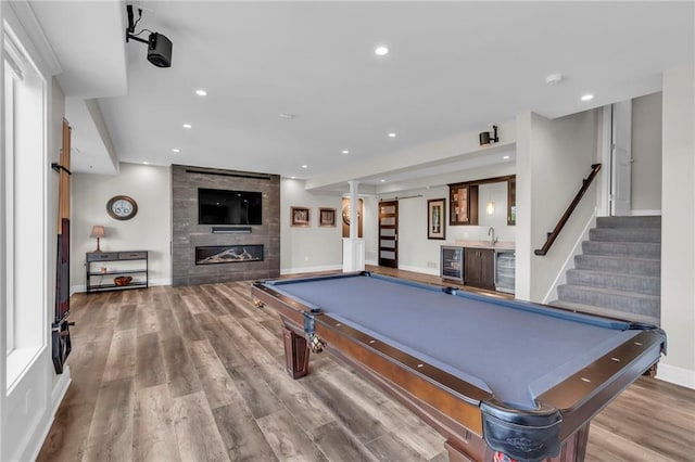 9812 Saddletop St, Lenexa, KS 66227 - game room with bar with sink, wine cooler, billiards, wood finished floors, and recessed lighting