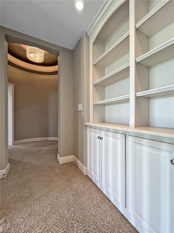 9812 Saddletop St, Lenexa, KS 66227 - corridor featuring baseboards and light colored carpet