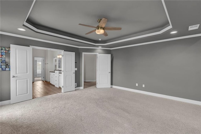 9812 Saddletop St, Lenexa, KS 66227 - unfurnished bedroom with a raised ceiling, carpet flooring, recessed lighting, ornamental molding, and ceiling fan