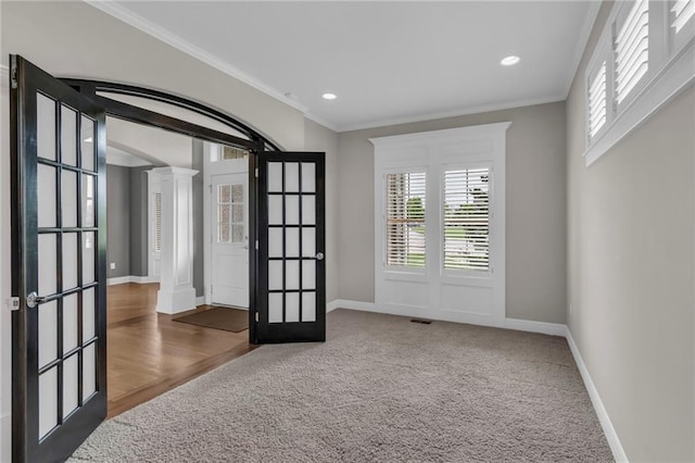 9812 Saddletop St, Lenexa, KS 66227 - empty room featuring ornate columns, french doors, crown molding, carpet, and recessed lighting