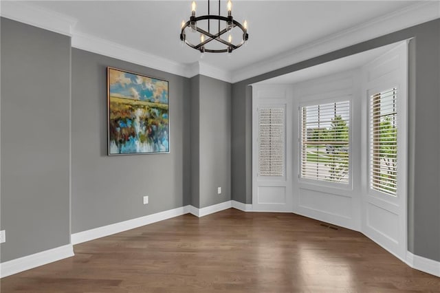 9812 Saddletop St, Lenexa, KS 66227 - unfurnished room with a chandelier, wood finished floors, and crown molding