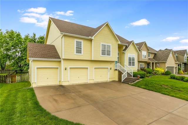 2420 SW Golden Eagle Rd, Lees Summit, MO 64082 - view of front of home featuring driveway, an attached garage, and a residential view