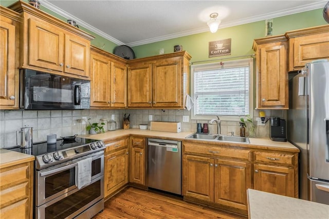 2420 SW Golden Eagle Rd, Lees Summit, MO 64082 - kitchen featuring stainless steel appliances, a sink, light countertops, backsplash, and ornamental molding