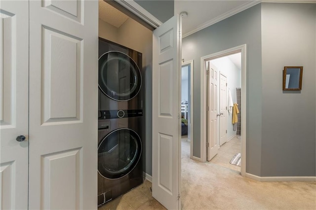 2420 SW Golden Eagle Rd, Lees Summit, MO 64082 - laundry area featuring stacked washer / dryer, light carpet, ornamental molding, and baseboards