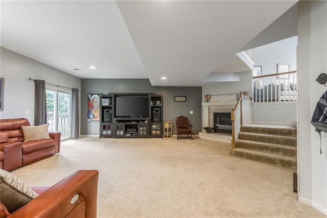 2420 SW Golden Eagle Rd, Lees Summit, MO 64082 - carpeted living area with a tile fireplace, recessed lighting, baseboards, and stairs