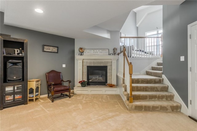 2420 SW Golden Eagle Rd, Lees Summit, MO 64082 - living room with carpet floors, stairway, a tile fireplace, recessed lighting, and baseboards