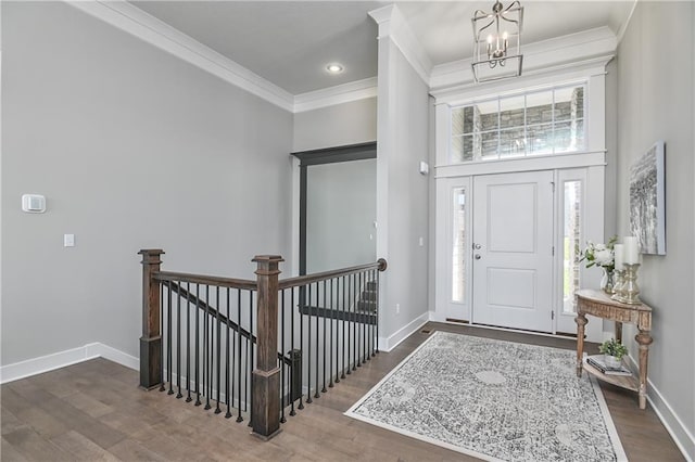 5858 Mccormick Dr, Shawnee, KS 66226 - entryway with a chandelier, baseboards, dark wood-type flooring, ornamental molding, and a towering ceiling