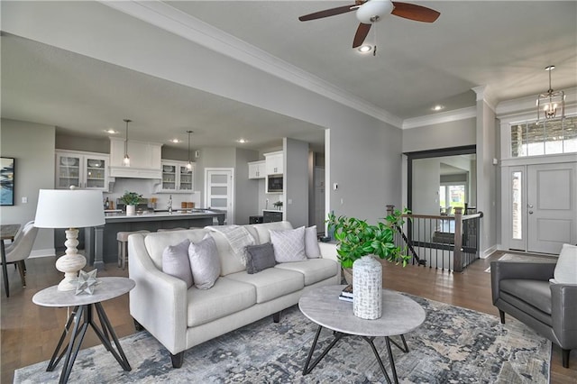 5858 Mccormick Dr, Shawnee, KS 66226 - living room featuring dark wood-type flooring, ornamental molding, ceiling fan, recessed lighting, and baseboards