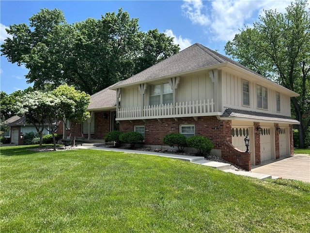 14601 E 44th St, Independence, MO 64055 - split level home featuring a garage, driveway, a front lawn, and board and batten siding