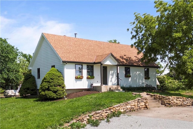 15215 Edgerton Rd, Gardner, KS 66030 - view of front of property featuring a front lawn and a shingled roof