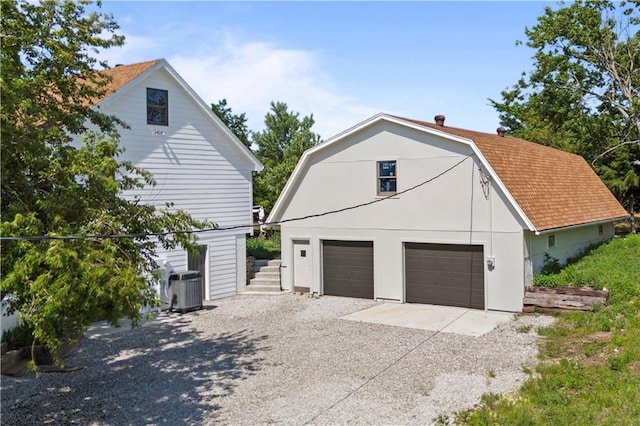 15215 Edgerton Rd, Gardner, KS 66030 - garage featuring central air condition unit and concrete driveway