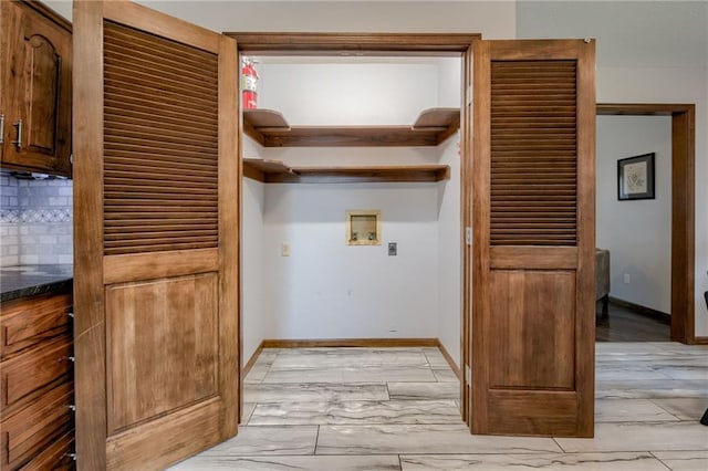 15215 Edgerton Rd, Gardner, KS 66030 - washroom with hookup for a washing machine, baseboards, and light marble finish floors