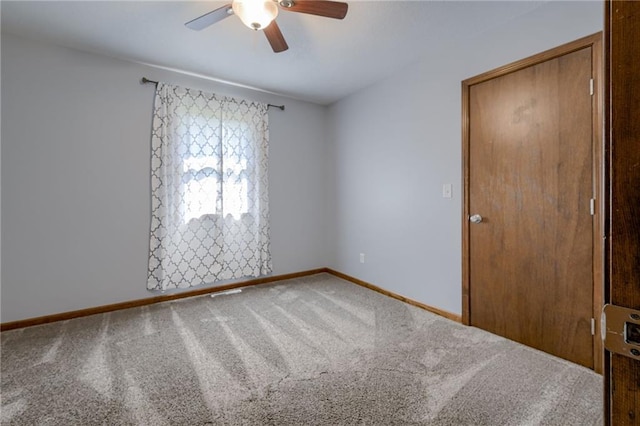 15215 Edgerton Rd, Gardner, KS 66030 - carpeted empty room with a ceiling fan and baseboards